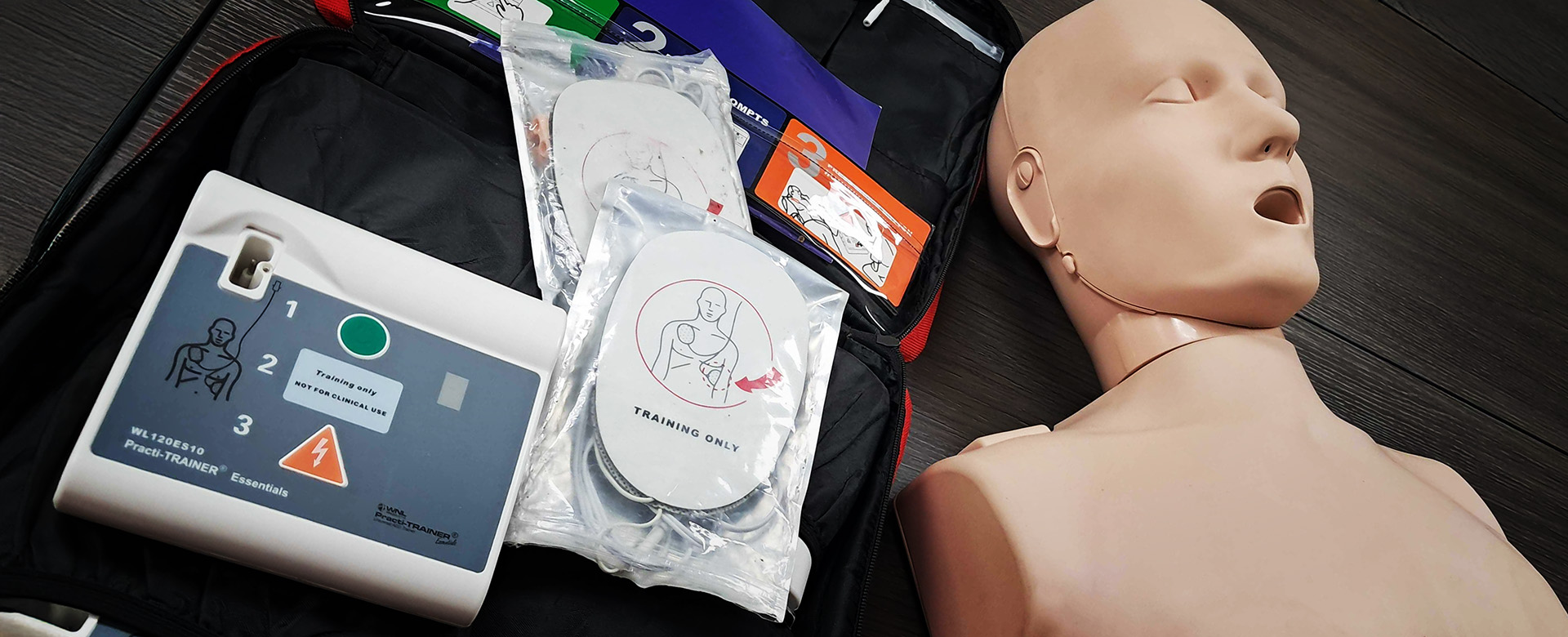 CPR training mannequin and automated external defibrillator